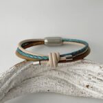 Lederarmband mit Knoten in taupe petrol