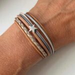 Lederarmband mit kleinem Stern grau beige