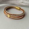 Lederarmband mit einer Spirale Gold in braun beige