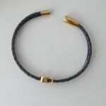 das Armband mit Fisch Gold in schwarz oder blau